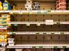 Butter and cheese shelves are seen empty at a supermarket in Miami Beach, Florida on January 13, 2022. - The ongoing strains of the coronavirus pandemic have led to sickened workers and staffing shortages for crucial supply-chain functions such as transportation and logistics, which affect the delivery of products and restocking of store shelves. (Photo by CHANDAN KHANNA / AFP)
