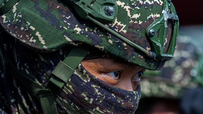 A Taiwanese soldier participates in an amphibious landing drill during the Han Kuang military exercise, which simulates China's People's Liberation Army (PLA) invading the island (Photo by Annabelle Chih/Getty Images)