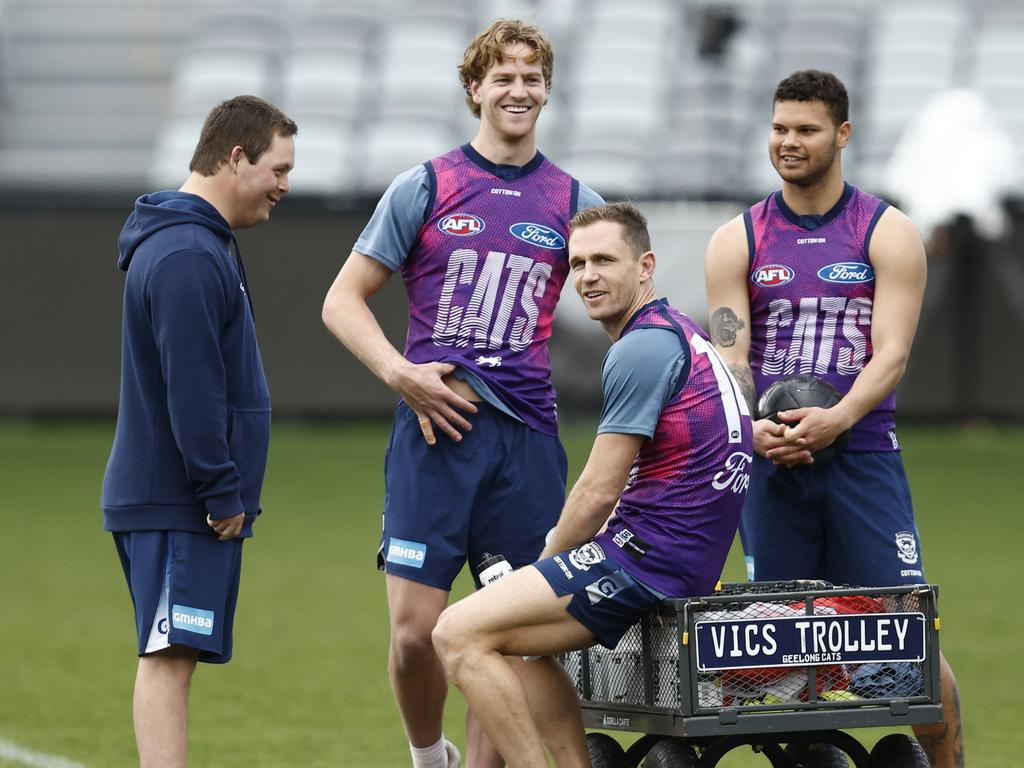 Cats players have a chat. Picture: Darrian Traynor/Getty Images