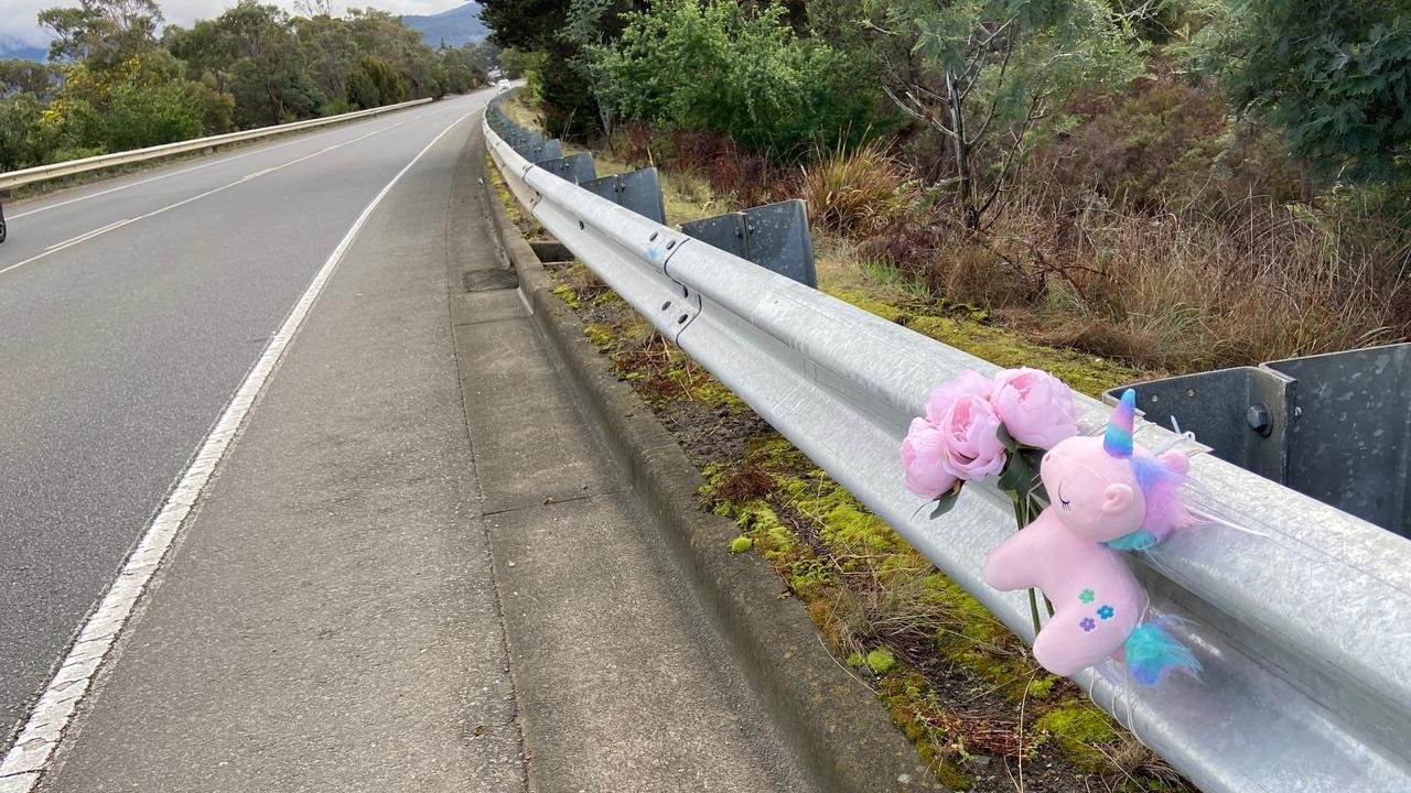 Floral tributes and a small toy unicorn lay at the fatal crash site on Algona Road, where a Huntingfield father and his young daughter died in a car crash. Photo: Phil Young