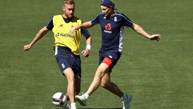 Root and Stuart Broad have a little light competition. (Photo by Ryan Pierse/Getty Images)