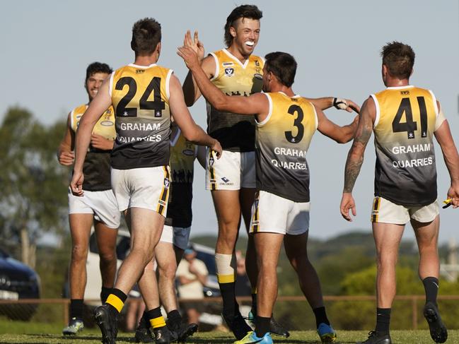 Frankston YCW ruckman Zach Barrett celerates with teammates. Picture: Valeriu Campan