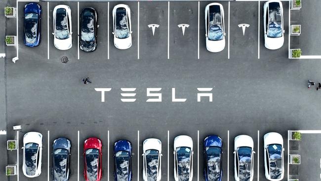 Brand new Tesla cars sit parked in a lot in California. Picture: AFP