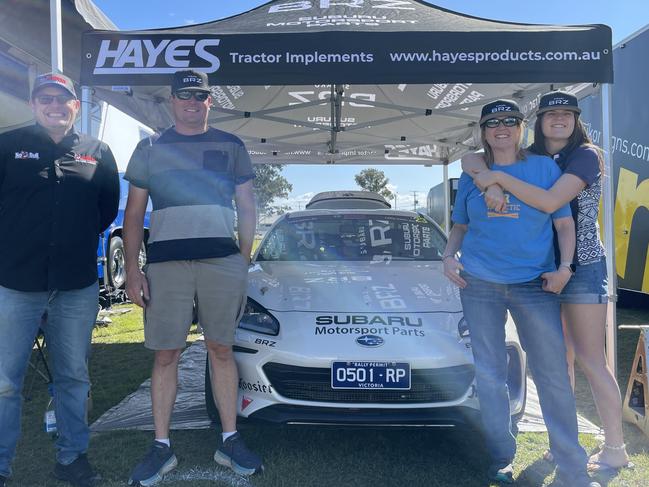 The Hayes family stand in front of their #23 Hayes Tractor Implements Subaru BRZ at Gympie Racecourse on July 21, 2023.