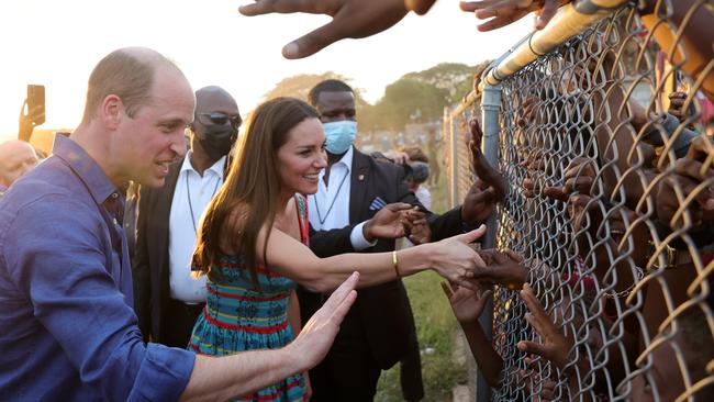 Pictures of William and Kate shaking hands with children through a wire fence have brought opprobrium on the couple. Picture: Getty Images.