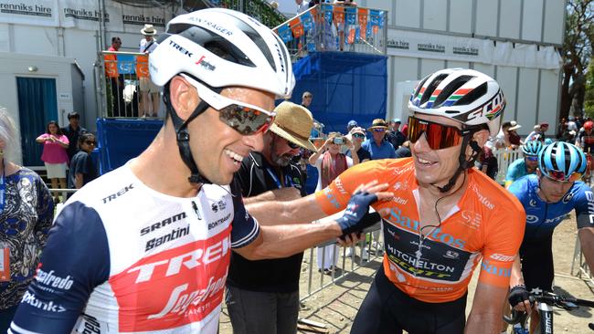 Defending champion Daryl Impey, right, congratulates Richie Porte on his victory at the conclusion of Stage 6 in Willunga. Picture: Brenton Edwards/AFP