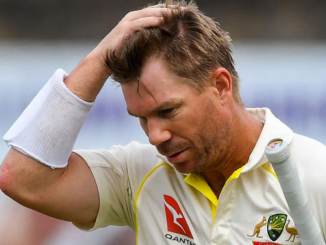 Australia's David Warner walks back to the pavilion after his dismissal during the fourth day of the second cricket Test match between Sri Lanka and Australia at the Galle International Cricket Stadium in Galle on July 11, 2022. (Photo by ISHARA S. KODIKARA / AFP)