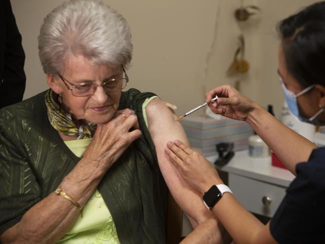 Rembrandt Aged Care resident Tinne Nieuwenhoven receives the Pfizer Vaccine in the age care facility at Oaklands Park, SA. Picture: Emma Brasier