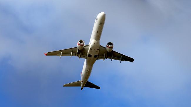 a Virgin plane takes off from Hobart Airport