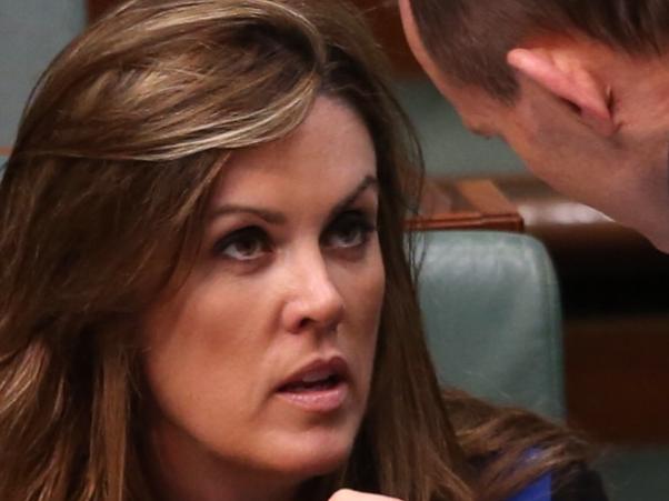 PM Tony Abbott confers with his chief of staff Peta Credlin during Question Time today in the House of Representatives, Federal Parliament, Canberra.