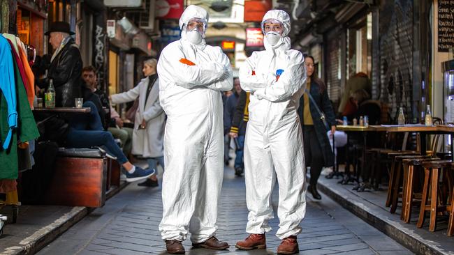 Will and Elise Mezner in hazmat suits in Melbourne. Picture: Sarah Matray