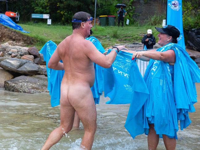 Volunteers handing out towels after the swim. Picture: Jordan Shields