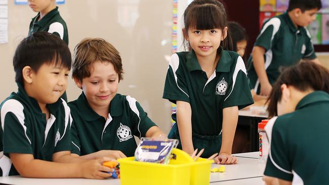 St Felix Catholic School year 3 students (from left) Aaron Le, Jack Drennan and Isabella Hoang, all 8, work together developing mathematical fluency. Picture: Jane Dempster/The Australian