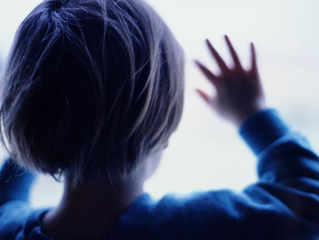 Generic image silhouette of young child with hands pressed against window. (Getty Images)