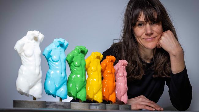 SALA Festival sculptor Georgina Mills with a row of colourful 3D printed versions of her sculpture titled Ivana. Picture: Emma Brasier