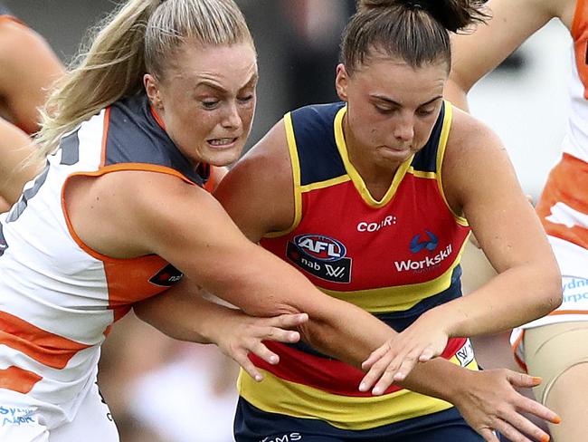 AFL WOMEN'S - Adelaide Crows v GWS Giants at Thebarton Oval. Ella Ross and Ebony Marinoff chase the ball. Picture Sarah Reed