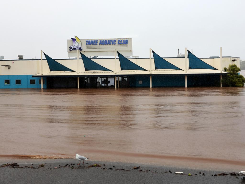 : Floodwaters are seen in and around Taree on the mid-north coast of NSW as torrential rain inundates the region. Picture: NewsWire / Scott Calvin
