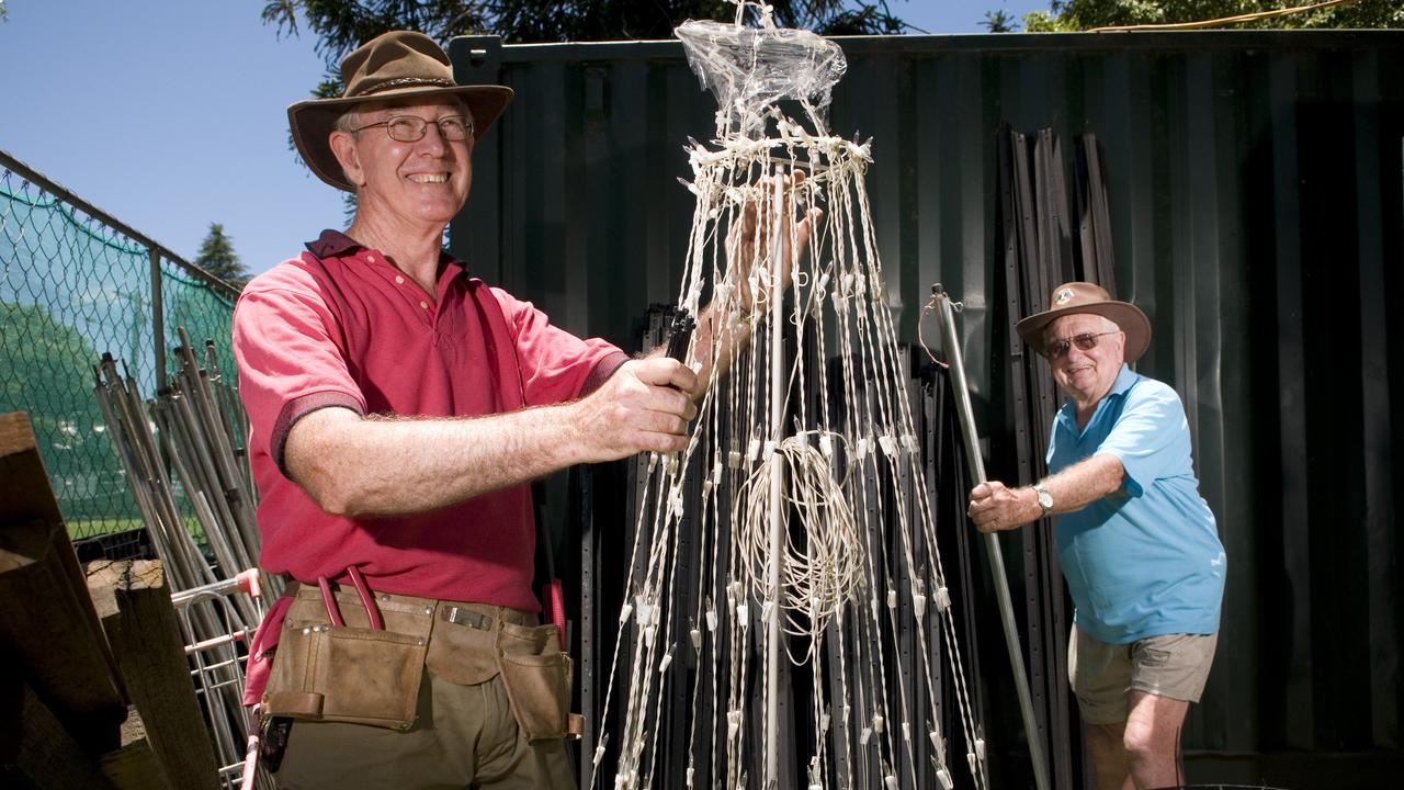 Lions Club of West Toowoomba members and volunteers including David Orton (left) and Harold Schiller get Queens Park ready for Toowoomba's Christmas Wonderland, Monday, November 25, 2013. Photo Kevin Farmer / The Chronicle