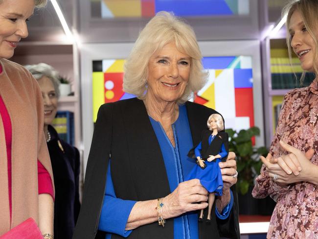 Her Majesty, Queen Camilla is presented with a Barbie in her likeness at Buckingham Palace in London, England. Picture: Getty Images