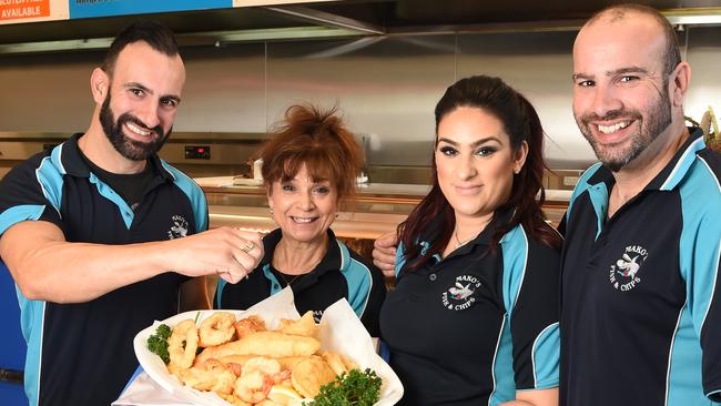 Anthony, Stavroula, Eleni and Michael with a gluten-free seafood platter in their Ferntree Gully store. Picture: Lawrence Pinder