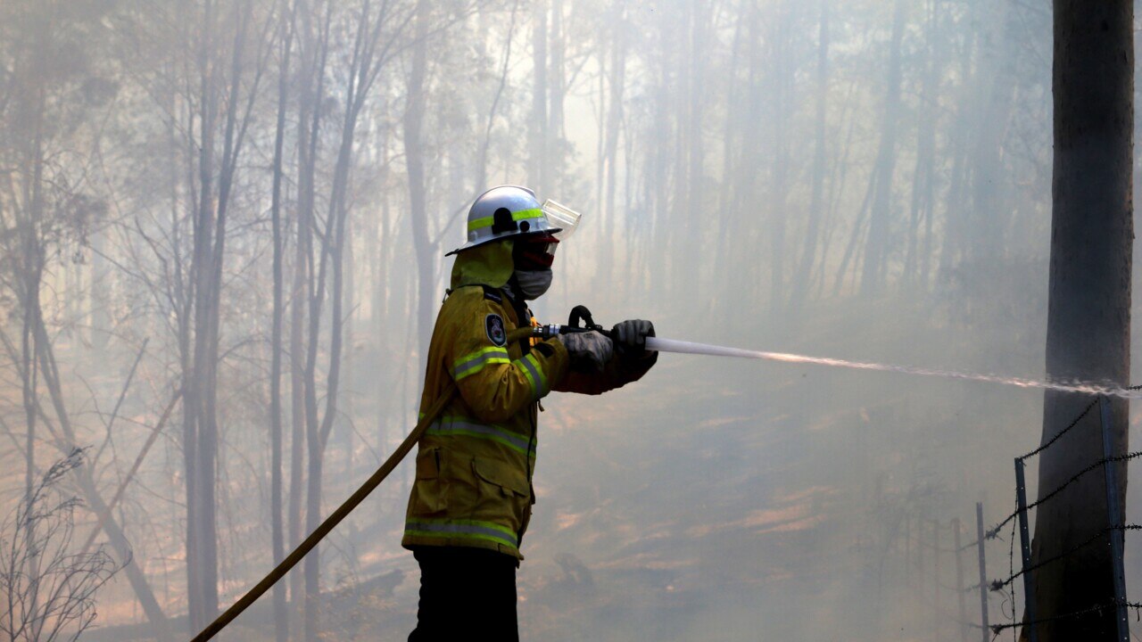 Happy Valley township rescued as fires still rage