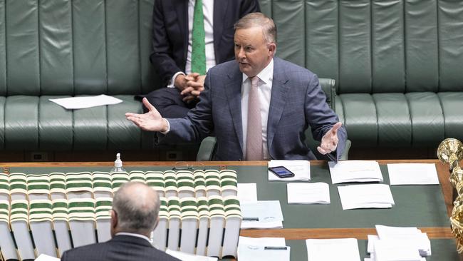 Prime Minister Scott Morrison with Anthony Albanese with a limited number of MP's during a recalled session of Parliament. Picture: Gary Ramage