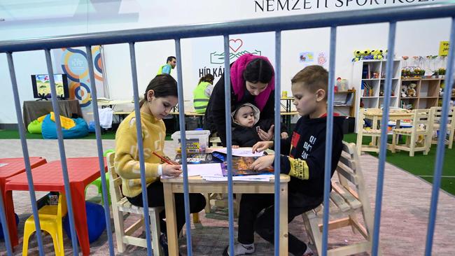 Ukrainian children play in a makeshift playground at the Budapest Olympic Centre. Picture: AFP