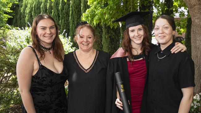 Undergraduate Certificate in Teaching (Primary) graduate Phoenicia Woodward-Xenides with family (from left) Assyria Woodward-Xenides, Tabetha Woodward-Xenides and Bella Singleton at a UniSQ graduation ceremony at The Empire, Tuesday, October 29, 2024. Picture: Kevin Farmer