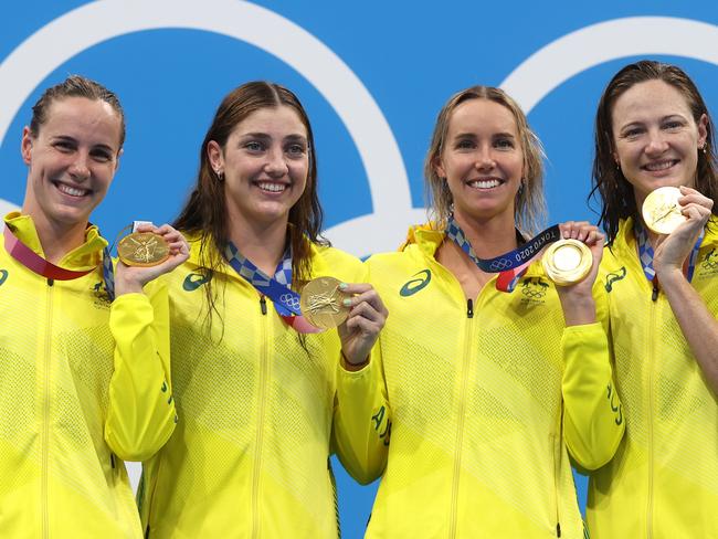 TOKYO, JAPAN - JULY 25: (L-R) Bronte Campbell, Meg Harris, Emma Mckeon and Cate Campbell of Team Australia pose after winning the gold medal in the Women's 4 x 100m Freestyle Relay Final on day two of the Tokyo 2020 Olympic Games at Tokyo Aquatics Centre on July 25, 2021 in Tokyo, Japan. (Photo by Clive Rose/Getty Images)