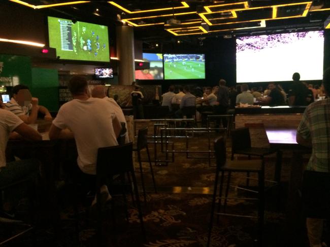 Patrons knock back beers as they would at any sports bar — except it’s 3am.