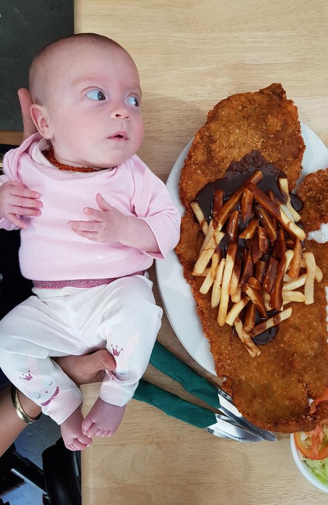 Sarah Atkins shared this photo of her baby daughter Jorja, alongside the epic crumbed steak at the Pinnacle Pub back in 2018.