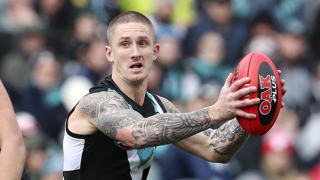 Hamish Hartlett says he’d proud he stayed at Port Adelaide despite interest from Richmond.