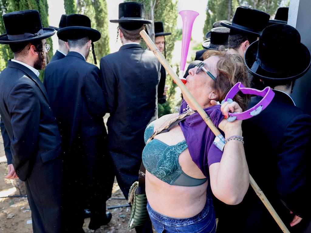 An Israeli protester challenges Ultra-Orthodox Jewish men’s army exemption during a Tel Aviv rally, which has ignited debate since the October 7 attack. Picture: Jack Guez/AFP