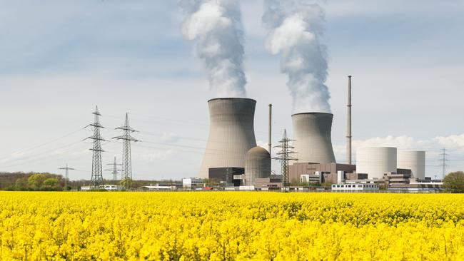 Nuclear power plant with yellow field and big blue clouds in Germany