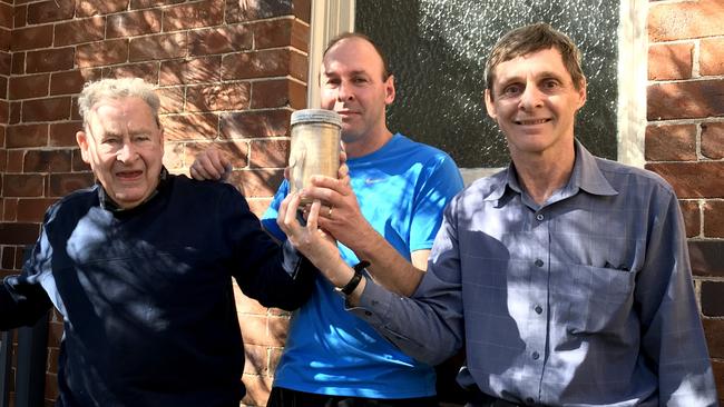 Ross, Richard and Mark Sterland holding the time capsule