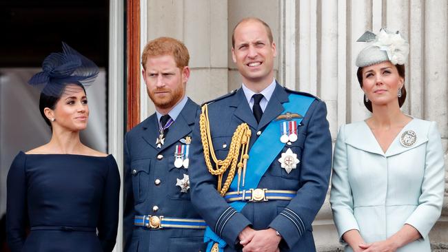 Meghan, Prince Harry, Duke of Sussex, Prince William and Catherine, watch a flypast to mark the centenary of the Royal Air Force from the balcony of Buckingham Palace in 2018.