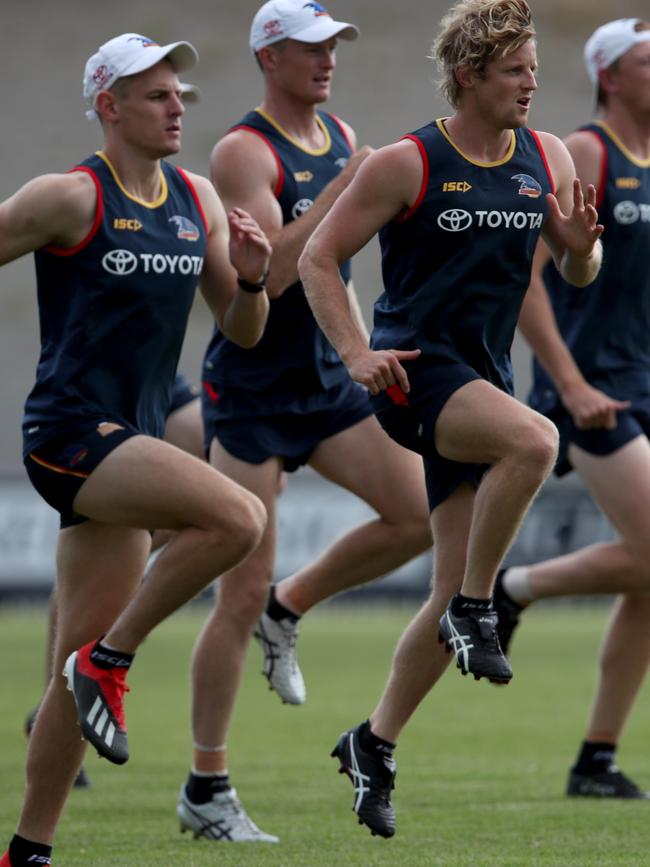 Crows players are put through a high-intensity training session at Noarlunga Oval on the final day of their pre-season camp on the Fleurieu Peninsula. Photo: AAP Image/Kelly Barnes