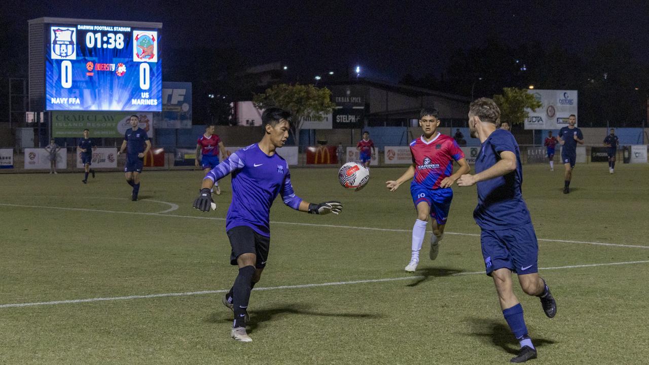 The Royal Australian Navy and United States Marine Corps men's soccer players competing for the ball. Picture: Supplied.