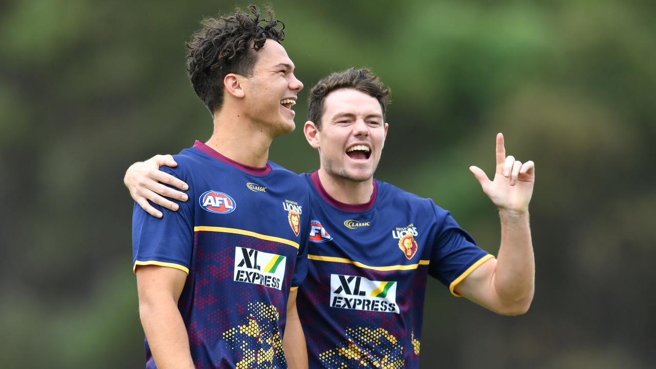 Lachie Neale enjoys a laugh with Cameron Rayner before his 47-possession game against Port Adelaide.