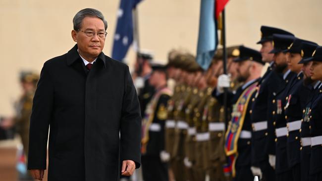 Chinese Premier Li Qiang inspects a guard of honour outside the Australian Parliament House in Canberra, Monday, June 17, 2024. Li Qiang, who is second only to President Xi Jinping, is on a four-day visit to Australia. (AAP Image/Lukas Coch) NO ARCHIVING