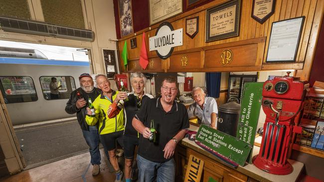 Linday Wilson, Don Sergeant, Richard Godbehere, John Smith and Darren Gloury enjoy a drink at the hidden bar at Lilydale station. Picture: Rob Leeson.