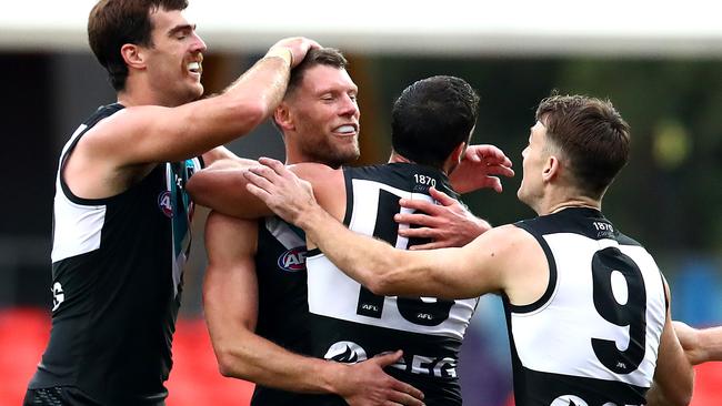 Scott Lycett, Brad Ebert, Travis Boak and Robbie Gray clebrate a goal during Port Adelaide’s win against West Coast at Metricon Stadium