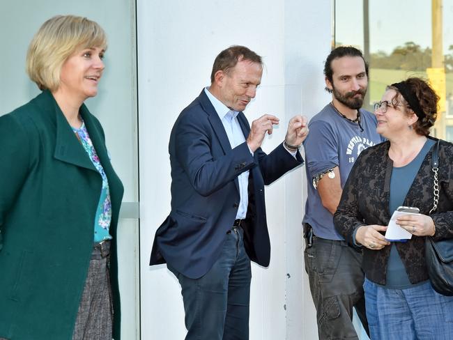 Both Tony Abbott and Zali Steggall were trying to sway voters at prepoll. Picture: Troy Snook