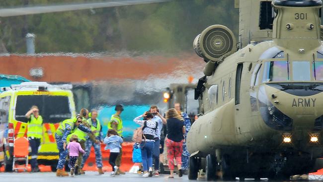 A defence force Chinook arrives at RAAF Base East Sale with evacuees from Mallacoota during Victoria's bushfire crisis. Picture: Mark Stewart