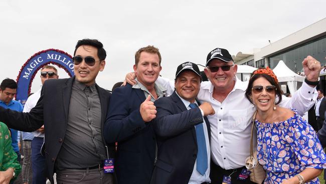 Winner of race 4 Madam Rouge connections celebrate  at the Magic Millions race day at the Gold Coast Turf Club. (Photo/Steve Holland)