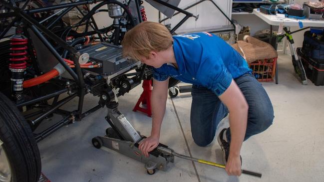 Bryn Jarvis working on the car that can drive 1,000km without charging. Picture: Supplied