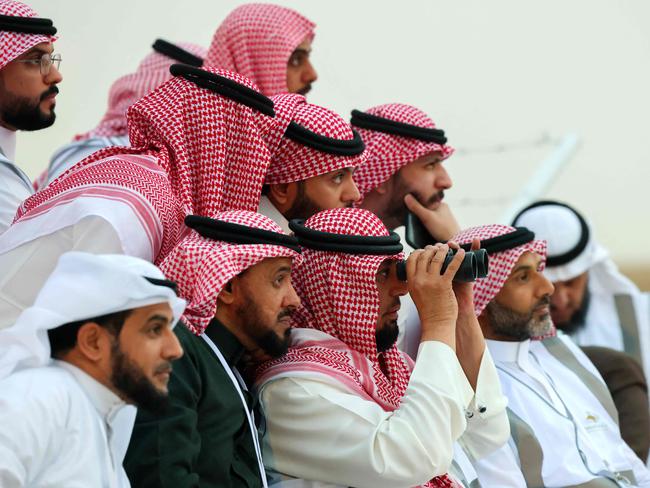 Saudi men look to spot the first crescent of the moon marking the start of the Muslim holy fasting month of Ramadan, in the southern Saudi city of Hautat Sudair, on March 10, 2024. Picture: AFP