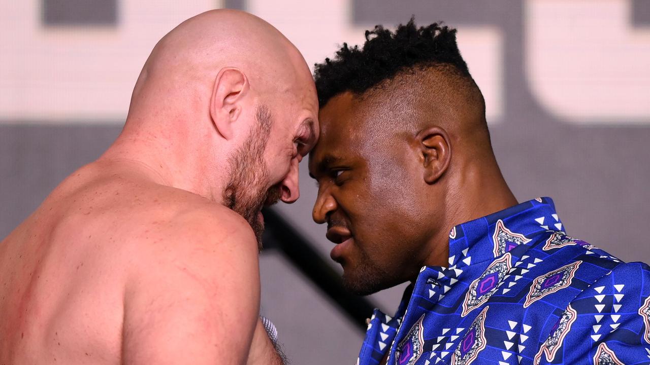 RIYADH, SAUDI ARABIA - OCTOBER 26: Tyson Fury and Francis Ngannou face off during a press conference ahead of the Tyson Fury v Francis Ngannou boxing match at Boulevard Hall on October 26, 2023 in Riyadh, Saudi Arabia. (Photo by Justin Setterfield/Getty Images)