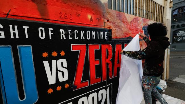 Painters replace Michael Zerafa on the mural to promote the fight between Tim Tszyu and Zerafa's replacement, Steve Spark.