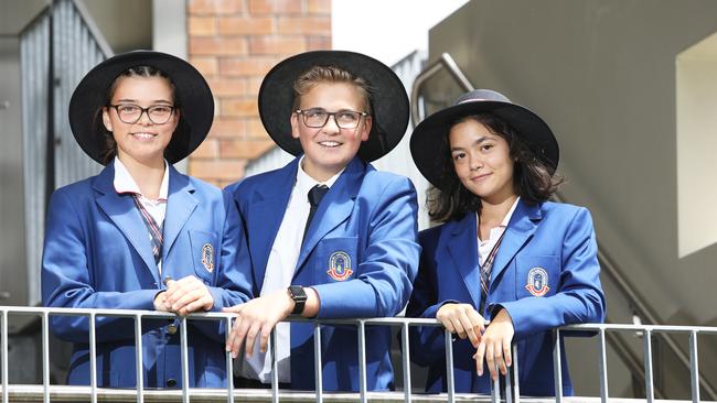 Gaby Bishop, 15, Matthew Stoward, 15, and Alyza Jffery, 14, pose at Cannon Hill Anglican College in Brisbane. Picture: AAP/Claudia Baxter.